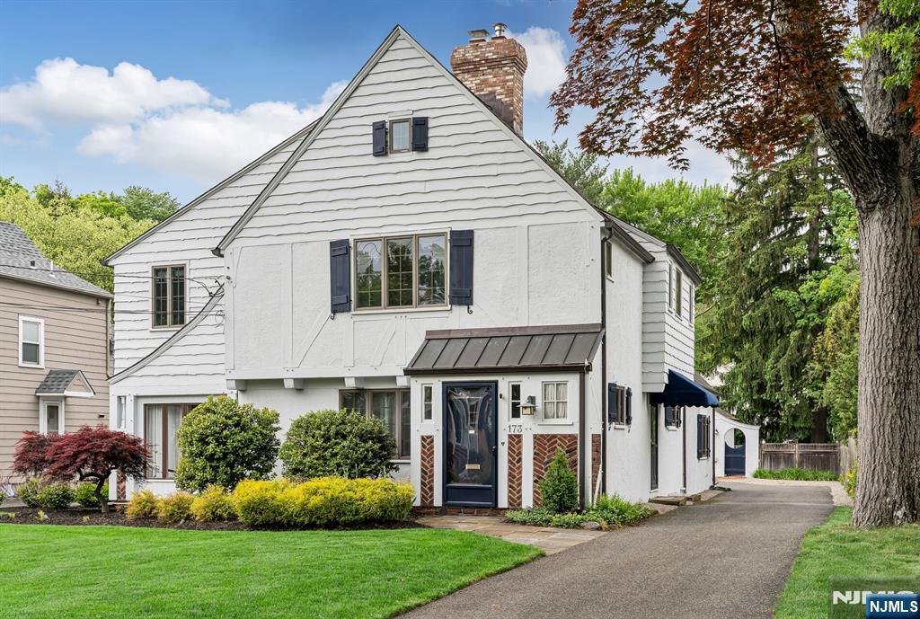 Experience the best of Ho-Ho-Kus in this beautifully updated Cheelcroft Tudor, where classic charm meets modern living. This stunning 4-bedroom, 2.5-bathroom Tudor has been meticulously renovated to offer an exceptional lifestyle. Close proximity to the quintessential town, convenient transportation, and excellent schools, this home is perfectly situated. As you step through the brick entryway, you'll be welcomed into a formal living room featuring a cozy fireplace and an adjoining sunroom/office, perfect for work or relaxation. The elegant dining room boasts lovely built-ins and a custom bar cabinet, ideal for entertaining, while the custom kitchen is equipped with professional-grade appliances and radiant heated floors. Enter the expansive great room, which features a gas fireplace, stereo surround sound, radiant heated floors, and sliders leading to the serene back patio. The first floor also includes a laundry room and a versatile bonus room. Upstairs, you'll find the luxurious primary suite, along with three additional bedrooms and a full bathroom. The third floor offers a private retreat with an office, play space, and ample storage. Additional features include central air, a 6-zone heating system, copper leaders and gutters, a sprinkler system, and a whole-house generator, ensuring comfort and convenience throughout the year. Don't miss the opportunity to own this picturesque home in a prime location!