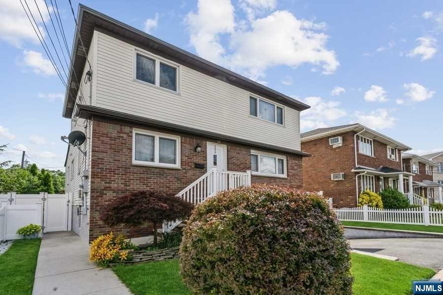 Welcome to this impeccable multi-family home on a fantastic block. This two family home features two units with numerous upgrades including a tranquil backyard with an in-ground pool and beautifully landscaped yard. Unit one features two floors of living space with 4 bedrooms with generous closet space, two full bathrooms with modern updates, central air and custom european windows that every homeowner will love . This unit also has a a large dining room, huge family room, full size washer and dryer and an added summer kitchen that easily connects to the backyard area. Unit two features two bedrooms, Eat-In Kitchen, new carpeting and updated appliances. Two car garage and a resort style backyard make this an awesome home not to be missed.