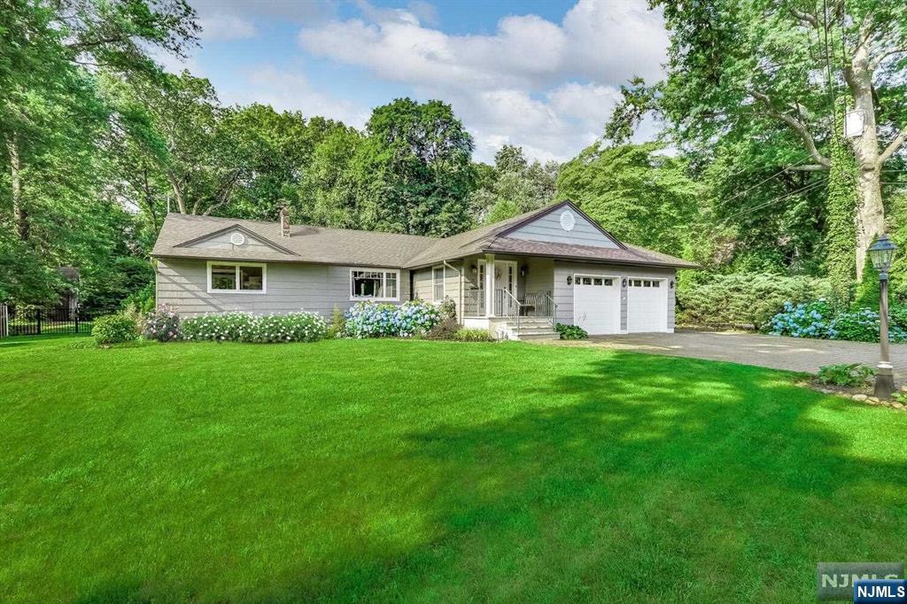 ou will fall in love with this expanded ranch on an oversized park-like property. Expansive patio is perfect for entertaining w/outdoor kitchen, built-in DCS gas grill, island & refrigerator. Cozy up by the fieldstone fireplace on cool evenings & enjoy summers at the semi-inground heated gas- pool. 1st floor feautures large entry foyer w/slate, bright LR w/FP & window seat. The open floor plan flows seamlessly to DR w/sliders, & kitchen w/center island, granite and stained glass window. This level also includes two bedrooms, full bath, & one of two convenient laundry facilities. Just a few steps up, you'll find a large primary BR suite w/wall of closets & elegant bath. Home is also situated for multi-generational living w/a FR, ptly finished basement w/kitchenette, full bath, bedroom with egress, office, and additional laundry.Amenities include a fully fenced yard, built-in surround sound system,LED lighting,large shed/workshop with concrete floor &50 AMP electric .