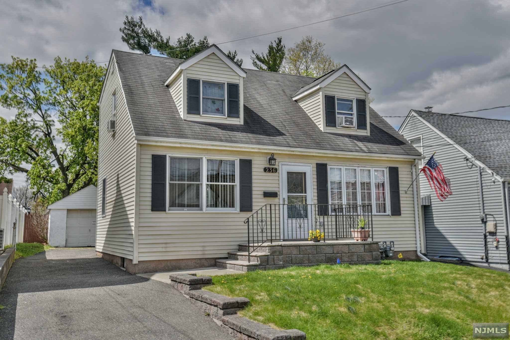 Don't wait! 4 / 5 BR Cape Cod with FULL rear dormer! This home has H/W floors, LRG Living room, EIK, 2 brs and full bath with walk in shower on first floor plus sliding doors to rear deck and yard. There are 2 bedrooms plus an office or nursery and full bath on the second floor. Basement is partially finished and has 1/2 bath, laundry room and storage. There is 3 zone heating, deep 132 foot lot, 1 car detached garage. Convenient Heights location close to all major highways and NYC Bus. Handicap ramp in the rear can be easily removed for deck expansion or patio area. Bring your imagination to make this your home sweet home. Sold "as is"