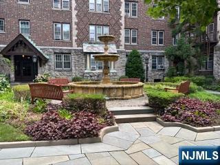 Welcome to this charming apartment in sought after Tudor Hall, a beautifully maintained pre war elevator building in the desirable East Hill neighborhood. Gated entrance, beautifully landscaped courtyard, winding pathways, a fountain and inviting garden benches. Bright and spacious apartment w/classic architectural details, 9 ft ceilings, original moldings and inlaid hardwood floors. The updated kitchen features granite counters and ss appliances. Expansive living room offers space for seating and dining area. The oversized bedroom has 2 large closets. Additional amenities include an on site laundry room, 1 assigned parking space and optional private storage for an add'l fee. Conveniently located near downtown shopping, dining, schools, library, hospital and NYC transportation. This is a non-smoking building. No pets permitted.