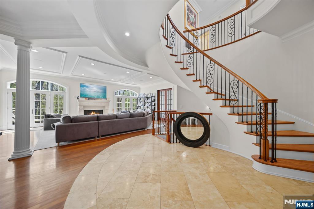Call us for private showings 201-398-9898 Set at the highest point within Demarestâ€™s coveted Bellaire community, 713 Bellaire Road offers a level of privacy, serenity, and exclusivity rarely found. Spanning nearly 6,000 SF, this extraordinary residence is one of the few homes in Bellaire positioned to capture sweeping views of peaceful woodlands and the prestigious Alpine Country Club, creating a setting that feels worlds away from townhome living. Here, every moment is framed by nature, where mornings begin with sunlight filtering through the trees and evenings are spent overlooking an unmatched natural backdrop from the expansive two-story deck and patio. A dramatic two-story foyer, sculptural staircase, private elevator, and fireplaces on all three levels establish a home defined by warmth and refinement. With 5 bedrooms, 4 full baths, and 2 powder rooms, the layout balances grandeur with comfort. The primary suite serves as a true retreat, featuring a boutique-style dressing room, spa-inspired bath, and adjoining private lounge with wet bar, ideal as a nursery, sitting room, or additional bedroom. Designed for elevated everyday living and effortless entertaining, this residence delivers the rare feeling of a secluded single-family estate within one of Bergen Countyâ€™s most exclusive communities, along with the opportunity for exclusive membership to Alpine Country Club for an additional fee.