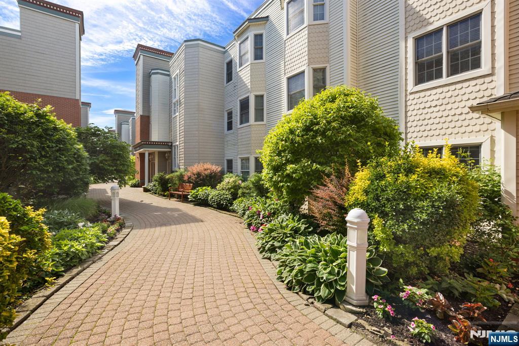 Rare opportunity to own a premier waterfront residence at The Promenade in the heart of Edgewater. This beautifully maintained 1-bedroom, 1-bath condominium offers approximately 850 square feet of bright, open living space highlighted by spectacular direct Hudson River and Manhattan skyline views. The thoughtfully designed floor plan features a spacious living and dining area, large windows that capture stunning natural light, and a private setting perfect for everyday living or entertaining. The kitchen is equipped with stainless steel appliances and ample cabinet space, while the nice sized bedroom offers comfort and functionality. Additional features include hardwood flooring, in-unit laundry, central air, and covered garage parking. Residents enjoy a sought-after waterfront lifestyle with convenient access to shopping, dining, transportation to NYC, and the Hudson River waterfront promenade. Experience luxury riverfront living with breathtaking views every day.