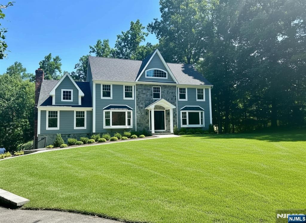Fully renovated 5-bedroom, 4-bath home on one of Upper Saddle River's most desirable cul-de-sacs. Grand two-story foyer opens to a formal dining room, spacious family room, and living room with cathedral ceilings and a gas fireplace. Updated kitchen features quartz countertops, center island, and a sun-filled breakfast area overlooking the multi-level deck and private backyard with an in-ground pool. First floor bedroom and full bath offer flexibility for guests or extended living. Upstairs includes a spacious primary suite with walk-in closet and en-suite bath, plus three additional bedrooms and a full bath. Finished basement with full bath provides additional living and entertaining space. Attached two-car garage. Move-in ready with exceptional indoor and outdoor living.