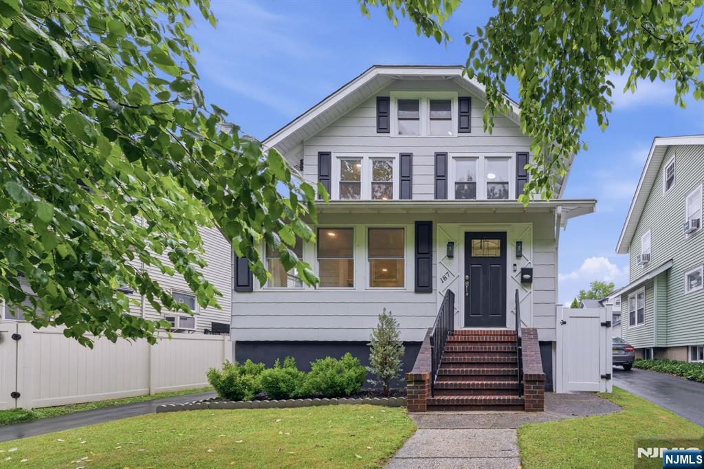 Move right into this beautifully renovated 3-bedroom, 2.5-bath Side Hall Colonial, completely updated in 2022 and offering four finished levels of living space, including a finished attic and finished basement. The first floor features an enclosed front porch, spacious living and dining rooms with hardwood floors, an open-concept kitchen with granite countertops, Samsung stainless steel appliances, and a convenient half bath. Upstairs offers three generously sized bedrooms and a beautifully renovated full bath. Major 2022 improvements include a new roof, all new windows, new electrical wiring with a 200-amp service, recessed lighting throughout, a new kitchen, and all new bathrooms. Outside, enjoy a newly paved driveway with parking for 4+ vehicles and a detached 2-car garage featuring a new roof, new windows, and new garage doors. Ideally located just two blocks from NYC transportation and close to schools, parks, shopping, and major highways, this move-in ready home offers the perfect combination of modern updates, functional living space, and commuter convenience. Don't miss this incredible opportunity!