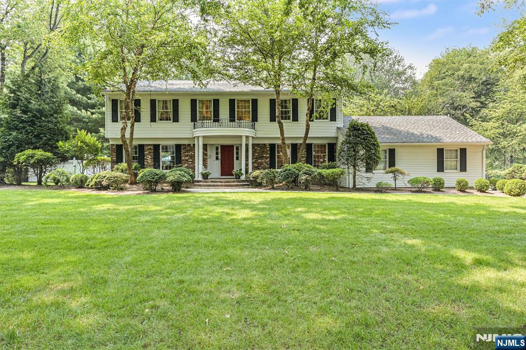 Presenting 7 Arthur Court, an impressive Center Hall Colonial nestled on a picturesque cul-de-sac in one of Demarest's most desirable neighborhoods. Custom built and lovingly maintained by its original owners, this exceptional home shows years of pride of ownership. A gracious entrance foyer welcomes you inside, with an elegant living room to one side and a formal dining room to the other. The first floor also features a spacious family room with a fireplace, a bright eat-in kitchen where you can enjoy breakfast overlooking the pool, a powder room, and a convenient laundry room. Upstairs, the sun-filled primary suite offers a generous walk-in closet and an ensuite bath with skylight. Three additional bedrooms and a full bath complete the second level. Set on a three-quarter-acre professionally landscaped property, the backyard is a true private retreat. Enjoy a resort-like setting with a spacious deck featuring a retractable awning with a view of the gunite in-ground pool, expansive patio, and poolside cabanaâ€”perfect for relaxing or entertaining, and an underground irrigation system. A rare opportunity to own an exceptionally well-maintained Colonial on breathtaking property in one of Bergen County's most sought-after communities. Ideally located near Demarest's top-rated schools, the scenic Duck Pond, library, swim club, tennis courts, parks, dining, and convenient New York City transportation.