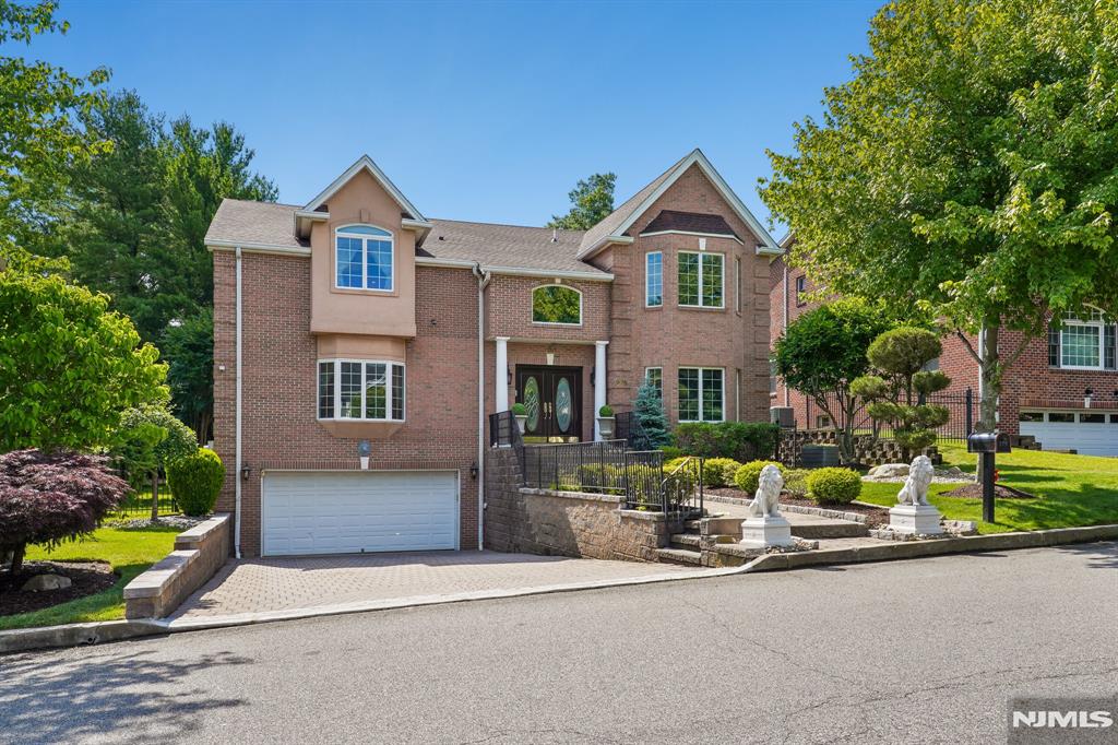 **First Time on the Market!** Ideally located in the prestigious community of Englewood Cliffs, this meticulously maintained custom home is being offered for sale for the first time. Conveniently situated with easy access to New York City, major highways, shopping, and dining, this spacious residence combines comfort, functionality, and pride of ownership throughout. Recent improvements completed in 2026 include a new roof , garage floor sealing, and professional power washing. The home features 5 bedrooms and 5.5 bathrooms across three levels. The first floor offers a gracious living room, formal dining room, laundry room, powder room, and a guest bedroom with a full bath. The second floor includes three additional bedrooms, two full bathrooms, and a spacious primary suite with a luxurious en-suite bath. The finished basement provides additional living and recreational space and includes a full bathroom. Additional highlights include six-zone HVAC, a 75-gallon water heater replaced approximately six months ago, and exceptional upkeep by the original owner since construction. A rare opportunity to own a beautifully maintained home in one of Bergen County's most desirable neighborhoods.