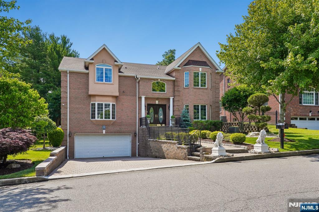 **First Time on the Market!** Ideally located in the prestigious community of Englewood Cliffs, this meticulously maintained custom home is being offered for sale for the first time. Conveniently situated with easy access to New York City, major highways, shopping, and dining, this spacious residence combines comfort, functionality, and pride of ownership throughout. Recent improvements completed in 2026 include a new roof , garage floor sealing, and professional power washing. The home features 5 bedrooms and 5.5 bathrooms across three levels. The first floor offers a gracious living room, formal dining room, laundry room, powder room, and a guest bedroom with a full bath. The second floor includes three additional bedrooms, two full bathrooms, and a spacious primary suite with a luxurious en-suite bath. The finished basement provides additional living and recreational space and includes a full bathroom. Additional highlights include six-zone HVAC, a 75-gallon water heater replaced approximately six months ago, and exceptional upkeep by the original owner since construction. A rare opportunity to own a beautifully maintained home in one of Bergen County's most desirable neighborhoods.