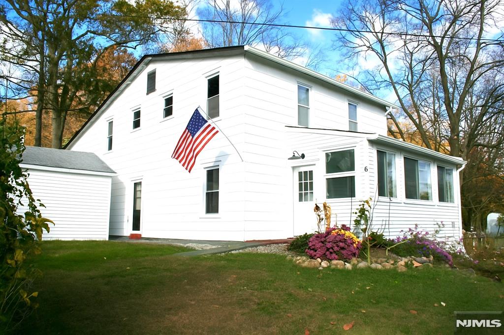 Welcome to this bright and freshly updated 3-bedroom, 1-bath apartment on the second floor of a well-kept two-family home, perfectly located in the Lake Hopatcong section of Jefferson Township. Enjoy a beautifully remodeled kitchen and bathroom, plus brand-new appliances being installed this week. The spacious laundry room offers extra storage or the perfect spot for an oversized pantry. Step right out onto your brand-new deck off the kitchen ideal for grilling, relaxing, and entertaining while taking in the seasonal lake views. Off-street parking for two cars makes daily life easy and convenient. Pets are welcome for a small additional fee ($50). A comfortable, stylish home in a peaceful setting don't miss it!