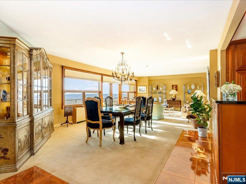 Enjoy a life of quiet luxury and effortless convenience at The Claridge, one of Essex County's premier full-service high-rise communities! This elegant one Bedroom residence on the 8th floor offers an open-concept layout with Chef's Kitchen, premium finishes and a spacious Living/Dining room with access to a private balcony. The generously sized Bedroom features a luxurious ensuite Bath with two walk-in closets, tub shower and vanity. Additional highlights include abundant natural light from oversized windows, beautiful parquet floors, a chic Foyer with Powder Room, in-unit stackable Washer/Dryer and a storage locker conveniently located on the same floor. Residents enjoy full-service amenities, including 24/7 doorman and valet, heated outdoor pool with picnic/BBQ area, putting green, tennis and pickleball courts, fitness center with sauna, library and multiple party rooms. Easy access to major highways and just five minutes to Montclair's museum, shops and dining. Monthly maintenance includes heat, water, electricity and full use of all amenities.