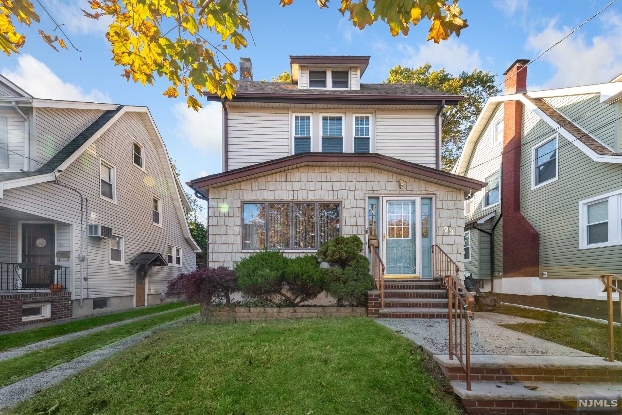 Welcome to this fully renovated colonial home with open floor plan. Updated kitchen with island overlooking dining room, wood-burning fireplace & 3 season room on first fl . Hardwood floors and recess lighting throughout house, large deck, renovated baths & detached 2 car garage. Finished basement with bathroom, 2 generous sized Bedrooms on second fl. with a walk-up to 3rd bedroom. Private backyard. Close to NY trans, schools, shopping & easy access to al major highways.