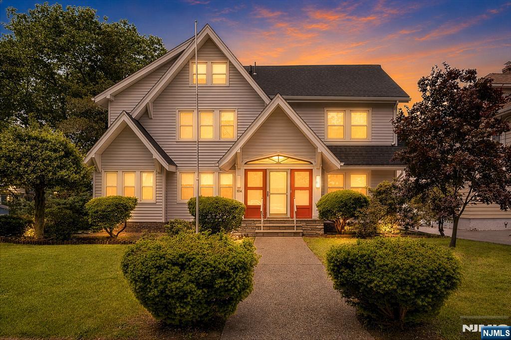 Welcome to 104 Carmita Ave in Rutherford the classic center stairwell colonial style home you've been waiting for! This home has size, charm, and an idealistic location close to NYC transportation. The lovely home starts with an adorable vestibule with wood detail and storage benches on each side and an antique front door. The foyer warmly greets you from there where you will instantly fall in love with the white oak floors throughout the home. The center stair case offers such charm and elegance with a convenient coat closet. The living room offers gorgeous spacing and light with two separate versatile rooms to the side creating a lovely study with 2nd fireplace and sun room. The dining room on the opposite side is generously sized and ready for hosting. The kitchen is in the back of the home looking over the yard and features a convenient powder room. The second floor has four nicely sized bedrooms, two full bathrooms, and plenty of closet space. The third floor features two additional bedrooms, full bathroom, and large cedar closet. The basement is full and finished with a nice rec room, large storage area, laundry room, and half bathroom. The yard is great size and there is a two car garage with a driveway for 4 cars. Come see the beauty and value this large corner property home on a 67x159 lot has to offer in this wonderful town!