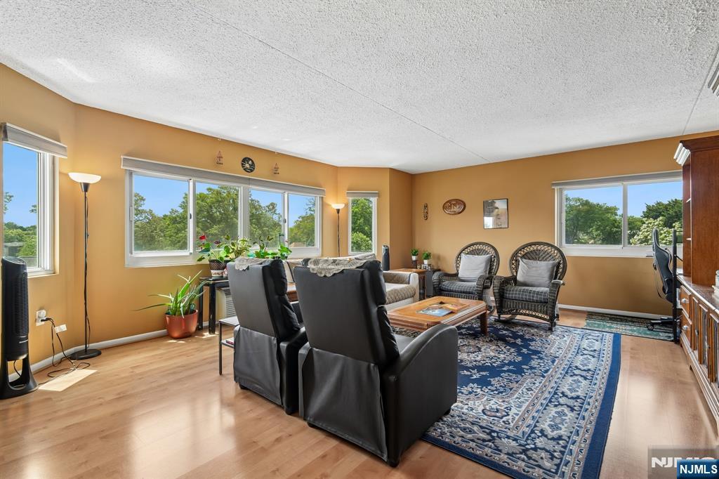 Welcome to the Prospect Ashley in the prestigious Fairmount section of Hackensack. This extra large, (1,353 square feet) light and bright unit has a great open floor plan. It features the Entry foyer, open kitchen with granite counter tops, stainless appliances and custom breakfast bar. Large open living room and dining room. Large master bedroom with master bath and walk-in-closet. Large 2nd bedroom and 2nd bath. Newer flooring throughout. Washer and dryer in unit. Small dog okay up to 25 lbs. Comes with a covered parking space. Great views from the windows. Just move right in. Close to several malls, HUMC, schools and easy access to several highways. A short walk to NYC Transportation.