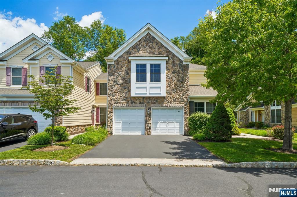 Rare opportunity to own the largest model in Parsippany's premier Four Seasons adult community! This spacious and airy 4-BR, 2.5-BA townhouse stands completely apart as the only unit featuring hardwood floors throughout both the first and second levels. The main floor boasts a serene living room with custom shutters, a private patio, a formal dining room, and an eat-in chef's kitchen with granite and stainless steel. Enjoy the ultimate convenience of a first-floor primary suite featuring a walk-in closet and a luxury bath with a jetted tub and double vanity. The second floor offers a versatile family room lounge, 3 additional large bedrooms, a full bath, and a massive storage room. Complete with an attached 2-car garage, central vacuum, and a laundry room. Unbeatable location with the Lakeland Bus to NYC right at the main entrance and easy walking distance to ShopRite and dining at Arlington Plaza. A must-see!