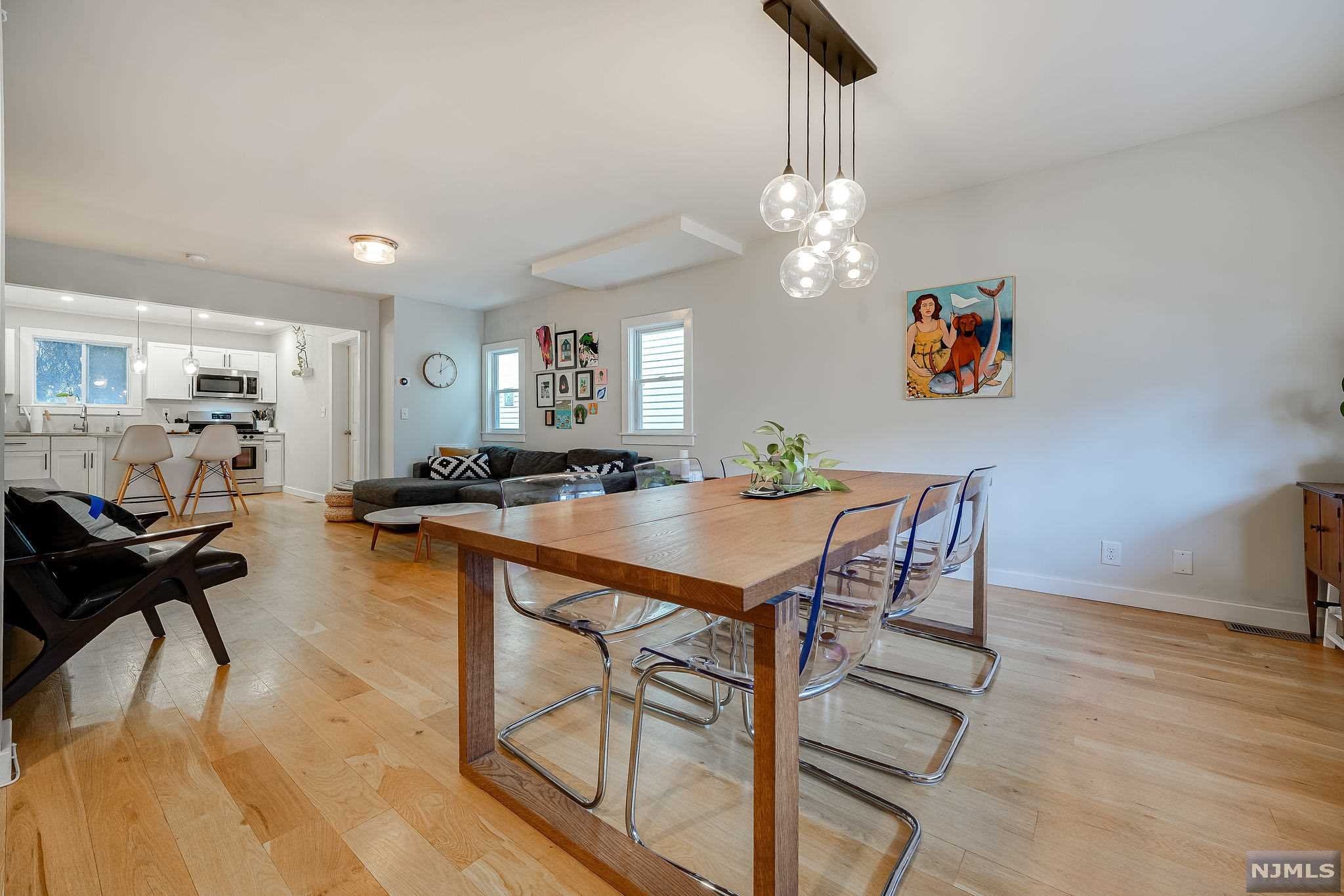 Welcome to your next home in the West Bergen neighborhood of Jersey City! This well-loved, move-in ready, sweet and cozy starter home has everything you need to make it yours. Walk into a bright, airy open floor plan, perfect for entertaining. Enjoy the well-appointed kitchen with white shaker style, wood cabinets, sleek countertops, an eat-in island w/stainless steel appliances. Entertain guests easily with a half bath and stunningly large, peaceful backyard that can be enjoyed all year round. The second floor highlights two bedrooms with exceptionally creative storage space and well-sized full bath w/tub. The basement has tremendous possibilities to be turned into a guest room, office, den or playroom due to its size and proximity to the second full bathroom also complete with tub. This home features central ac & heat. 1 car parking makes this a dream. Proximity to all major highways, West Side Ave shopping, ALL NYC Transportation. COME MAKE THIS ONE YOURS!
