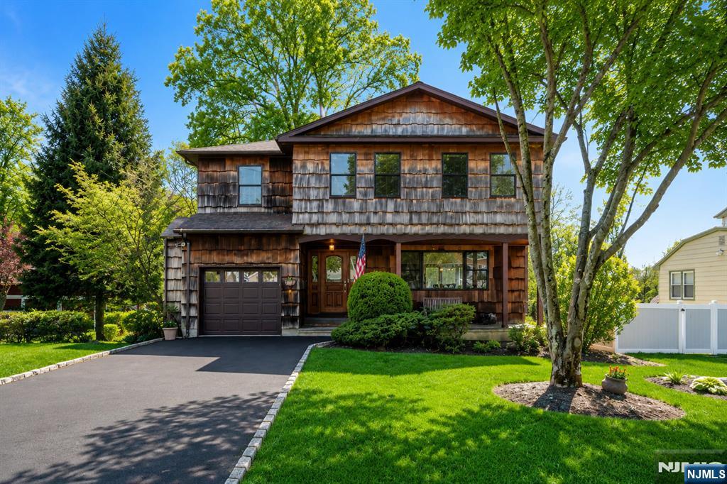 Set on a generous half-acre in a quiet West Caldwell neighborhood, this spacious home at 10 Woodmere Rd. offers a comfortable blend of space, functionality, and standout design features. A welcoming front patio creates an inviting first impression, perfect for morning coffee or relaxed outdoor seating.Inside, the home opens to a thoughtfully designed layout filled with natural light. The expansive kitchen serves as a true centerpiece, featuring abundant cabinetry, extensive counter space, and a large center island ideal for meal prep, casual dining, or gathering. It flows seamlessly into the show-stopping great room, highlighted by soaring cathedral ceilings, exposed wood beams, a fireplace, and direct access to the deck. Creating a warm, open space well-suited for everyday living and entertaining.The home includes 4 generous bedrooms & 3 full bathrooms, including a spacious primary suite with a private en-suite bath. A second-floor laundry area adds everyday convenience, while the additional bedrooms offer flexibility for guests, work-from-home needs, or hobbies.Outside, the large, flat backyard provides ample space for recreation, gardening, or outdoor enjoyment. With its convenient location near local amenities, easy NYC transportation, this home brings together space, function, and a welcoming atmosphere in one place.