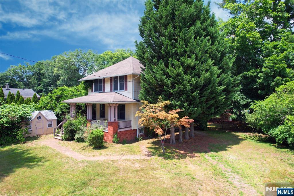 Wonderful pre-WWI gem! Sears Roebuck and Company catalog house constructed in 1913. Main level features Living Room, Dining Room, and Eat-in Kitchen. Living room is separated by a glass sliding pocket door that leads into dining room. Eat-in kitchen is off the dining room and there is a bathroom off kitchen with a pocket door. The second floor features 3 bedrooms and a full bath. There is an unfinished attic. The house has the original wood floors. Unfinished basement has the old coal room under the porch that is used for storage. This house hits at the end of a cul-de-sac. Large property. Two useable sheds. New hot water heater, refurbished boiler. Washer & dryer included. Electric oven and refrigerator included (Dishwasher does not work.) Gas generator included with the house sale. Great area. Close to parks, schools, restaurants, shopping, highways and transportation. There is a town lake for swimming and fishing, golf course, and a bike/pedestrian walking path. Easy commute to NYC!