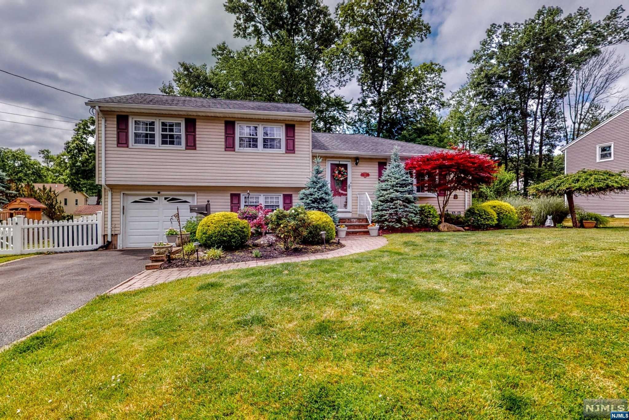 Welcome to this extraordinary, well maintained split level home that boasts a magnificent family room addition creating an open floorplan & the perfect place to enjoy many of life's celebrations. Nestled in the idyllic town of Montvale, this home offers an array of modern amenities including hardwood floors, crown moldings & recessed lights. Sit with a book & a cup of coffee in your formal living room. Create culinary masterpieces in the beautifully designed eat-in-kitchen to be served in your casual dining room while the football game is on in the sunlit family room. Open your sliding glass doors to enjoy a bar-b-que on your paver patio surrounded by your fenced-in yard. A ground level den provides space to work from home. Enjoy the basement level recreation room for movies or home gym. When the sun goes down, retire in one of 3 bedrooms & a newly renovated full bath on the 2nd floor. Experience everyday living in this home that offers a blend of comfort & tastefulness.