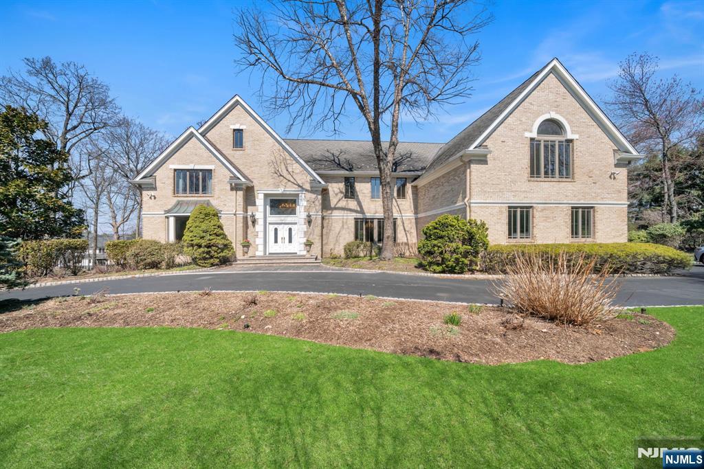 Set on over an acre of manicured grounds in the prestigious High Woods area of Franklin Lakes, this exceptional Leonard built, 5BR, 4.5BA estate offers approx. 6,081 sq ft of elegant living space designed for both everyday comfort and entertaining. A dramatic 2-story foyer opens to a sun-filled 2-story great room, while formal living and banquet-sized dining rooms provide the perfect setting for gatherings. The expansive Ulrich kitchen features dual sinks, dual dishwashers, abundant prep space, and a rear staircase. A first-floor guest bedroom with full bath and laundry room offer flexible living options. Custom millwork throughout highlights the homeâ€™s craftsmanship. Upstairs, the primary suite includes a sitting area, cedar walk-in closets, and a spa-like bath with soaking tub, separate shower, and private water closet. An en-suite bedroom and two additional bedrooms with a dual-entry bath complete the level. Outdoors, a resort-style pool and beautifully landscaped grounds create a private oasis for relaxing and entertaining. A rare opportunity in one of Franklin Lakesâ€™ most sought-after neighborhoods.