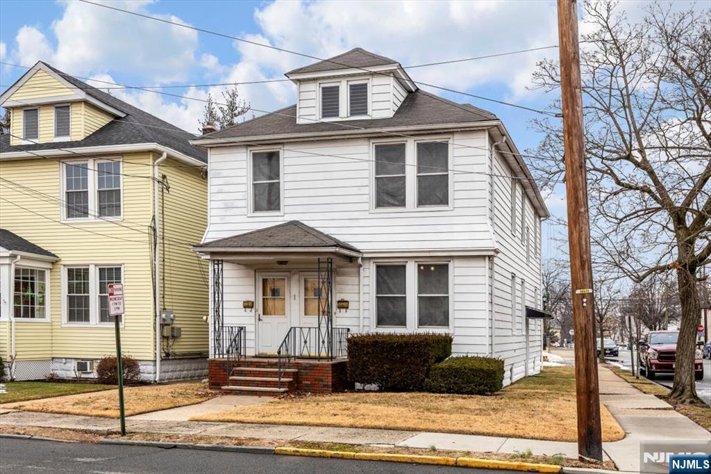 This large 2-Family home with a private entrance to each unit is located on the border of North Arlington & Lyndhurst. The Floor Plan is as follows 1st floor: Living Room, Formal Dining Room, Kitchen, 2 Bedrooms, Office, 1 Full Bath & Side Staircase to Basement. 2nd floor, Living Room, Formal Dining Room, Kitchen, 2 Bedrooms, Den, Office, 1 Full Bath & Side Staircase to Basement. Features include Replacement Windows, Hardwood Flooring & Carpeting, Separate Utilities, and a Detached Two-Car Garage. Walk to Transportation plus Easy Access to Major Highways. Restaurants, Shopping, Schools, or just about anything you may want or need is within walking distance. When Opportunity knocks... Call your Favorite Realtor to view this fantastic two-family home!!!