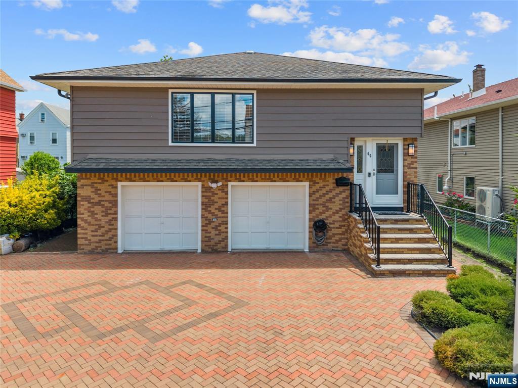 Welcome to this stunning fully renovated home located in the heart of the highly sought-after Athenia section just minutes from the train station, major highways, shopping, and dining. Completely reimagined with modern elegance and exceptional attention to detail, this move-in-ready home offers the perfect blend of style, space, and versatility.Step inside to discover bright, open-concept living spaces filled with natural light, beautifully updated kitchens and bathrooms, gleaming floors, and designer finishes throughout. Thoughtfully designed for flexible living, the home features a spacious in-law suite complete with a second kitchenette, offering both comfort and privacy while maintaining a warm and inviting atmosphere.Generously sized bedrooms, ample storage, and a beautifully maintained exterior make this property truly stand out. Whether you're looking for additional living space, guest accommodations, or simply a beautifully renovated home in a prime commuter location, this exceptional property checks every box.A rare opportunity to own a turnkey home in one of the area's most convenient and desirable neighborhoods!
