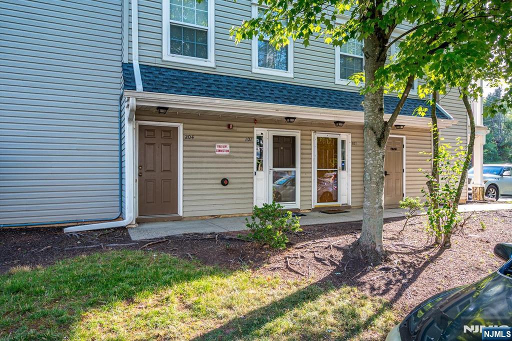 North-East Facing (Buyer to Verify) | Updated Three-Level Townhome in Village Pointe, Edison Welcome to this beautifully maintained 2-bedroom, 2.5-bath townhome in the desirable Village Pointe community. This thoughtfully designed three-level home offers modern updates, comfortable living spaces, and everyday convenience. The main level features an open-concept living and dining area with gleaming hardwood floors and abundant natural light. The updated kitchen includes custom wood cabinetry, granite countertops, a center island with additional storage, stainless steel appliances, decorative tile backsplash, recessed lighting, and ample workspace. Fresh interior paint and refinished hardwood floors add to the home's appeal. Upstairs, the spacious primary suite features a large closet and an updated en-suite bath with dual vessel sinks, a soaking tub, and a separate glass-enclosed shower. A second bedroom, full bathroom, and conveniently located laundry room complete the upper level. The entry level offers a welcoming foyer with direct access to an oversized attached one-car garage with additional storage, plus an assigned parking space. Located in a professionally maintained community with mature landscaping, this home is conveniently close to shopping, dining, parks, major highways, and public transportation. North-East facing orientation is based on available information; buyers are encouraged to verify.