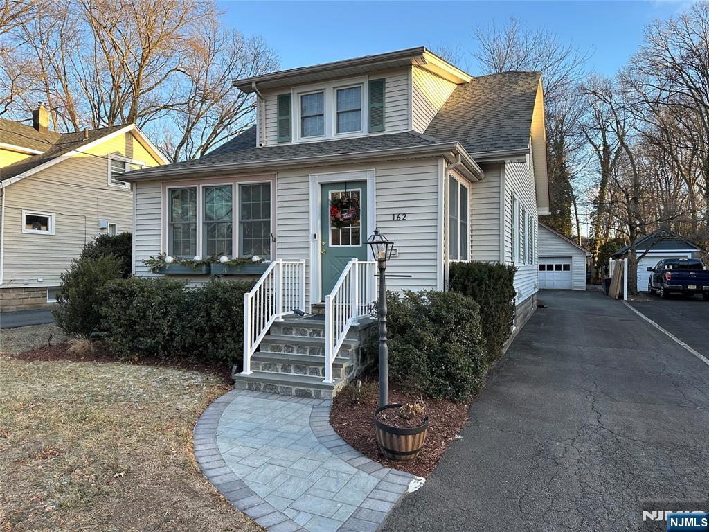 Welcome Home! This charming Colonial home is located in a quiet neighborhood in Wyckoff. This beautiful property boasts comfort and character, from its chestnut trim and oak floors to its sun filled four season porch to sip morning coffee and a wood burning fireplace to enjoy a cozy winter night! The kitchen has an ideal layout with a breakfast bar, lots of counter space and recently added recessed lighting, additional upgrades include central air and ductless A/C, new roof & electric to 200 amps, whole house water softener and filtration system. The second floor features 3 bedrooms, 2 with WIC, & a full bath. Full finished basement with a full bath, and lots of storage area, so everything has a place! The detached over sized garage, with electric and overhead storage. Newly constructed paver patio area is the perfect setting for gatherings HIGHEST & BEST - January 16, 2025 by 3 PM Provide updated POF or Pre-approval. Thank you for your interest in this beautiful home!