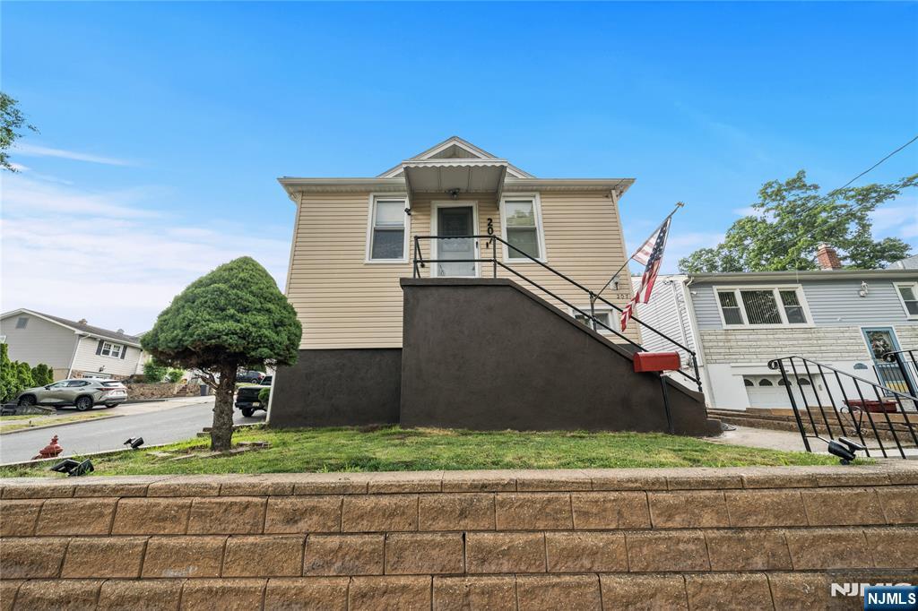 Welcome to 207 Van Winkle Avenue, a well maintained three bedroom home located on a quiet residential street in Nutley, just moments from DeMuro Park. The home features an updated kitchen with white shaker cabinetry and subway tile backsplash with cozy eat in area. The main level offers comfortable living and dining spaces filled with natural light, along with two bedrooms that provide flexibility for a variety of needs. Renovated full baths offer modern walk-in showers. The lower level includes bed room, laundry area, storage, and valuable bonus space with its own private ground level exterior access, creating opportunities for a home office, recreation room, or additional living space.Conveniently located near parks, schools, and major highways, this home offers an excellent opportunity to enjoy homeownership in Nutley, a community known for its convenience, neighborhood feel, and proximity to New York City, at a price point that is becoming increasingly difficult to find.