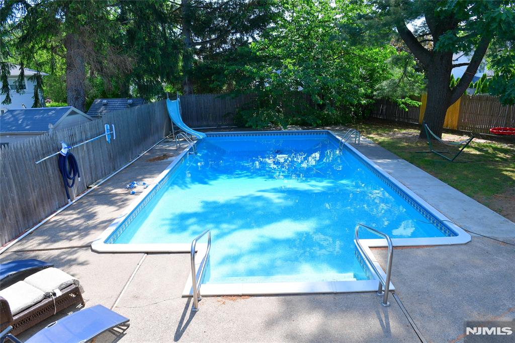 FRESHLY CLEANED, COMPLETELY VACANT, and ready for summer! This home presents a flawless canvas for its next owners. This exceptional property offers the perfect blend of generous living space and outdoor entertainment on the perfect lot. This property provides generous room for both indoor living and outdoor entertaining, ideal for hosting gatherings and creating lasting memories. Step into a spacious family room that sets a warm, welcoming tone, perfect for relaxing or spending quality time with loved ones. Just a few steps up, the first level features a formal living room, dining room, and a large eat-in kitchen complete with granite countertops, stainless steel appliances, and direct access to the Trex deck, your go-to spot for morning coffee or summer BBQs. The second level offers three bedrooms and a full bath, providing comfortable accommodations for family or guests. The perfect feature is the private primary suite, with a walk-in closet and its own primary bath. Step outdoor to the patio, and an in-ground swimming pool, your personal retreat for sunny days and weekend fun. Additional highlights include 2 zone HVAC and a roof thatâ€™s only four years old.