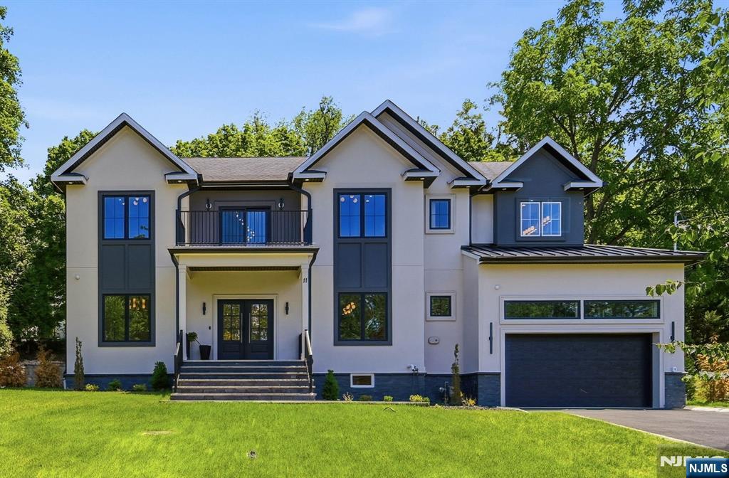 Welcome to this stunning custom stucco NEW CONSTRUCTION home in the sought-after Collins Elementary School district, offering 6 bedrooms, 5.5 baths & approx 5,000 sq ft of finished living space across 3 finished levels on a .36-acre lot.Thoughtfully designed, this exceptional residence showcases refined craftsmanship, elegant finishes & a highly functional floor plan.A covered front porch welcomes you into a dramatic 2-story foyer w/ wide-plank hardwood floors & custom millwork.The 10-ft 1st floor features a formal dining room & chef's kitchen w/ Thermador appliances, quartz countertops, center island w/ seating & walk-in pantry.The open layout flows into the impressive family room w/ soaring 20-ft ceilings, built-in speakers, a tiled fireplace & sliders to a paved patio.A 1st floor guest suite w/ full bath, functional mudroom, powder room & access to the 2-car garage complete the main level.The front door features a keypad entry system.Upstairs, the luxurious primary suite offers a balcony, oversized designer WIC & spa bath w/ double vanities, soaking tub & glass-enclosed shower. 3 add'l bedrooms, including 2 ensuites, all feature custom WICs, plus a laundry room w/ built-in cabinetry & utility sink. The finished lower level boasts 9-ft ceilings & includes a rec room w/ built-in speakers & wet bar, media room, flex room, bedroom, full bath & abundant storage.The completely private backyard is surrounded by Green Giants. Add'l highlights include a 10-Year Builder's Warranty.