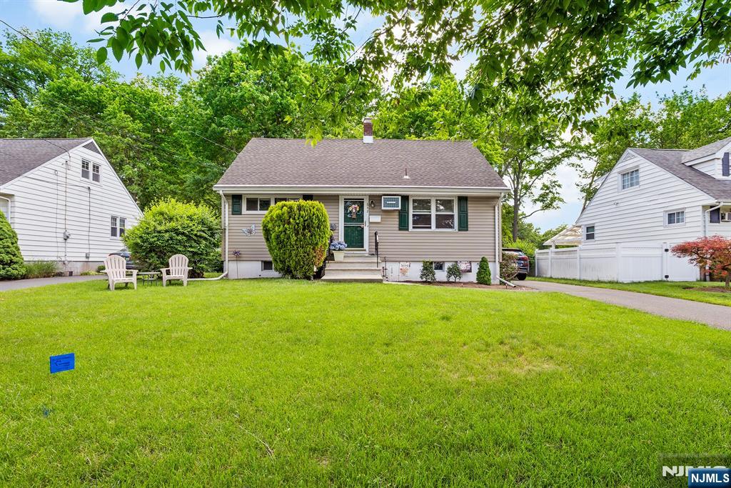 Welcome to 642 Ellington Road, a beautifully maintained Cape Cod nestled on one of Ridgewood's most picturesque streets. This charming 4-bedroom home offers the perfect blend of classic character and modern updates. A sun-filled living room flows seamlessly into the dining area and renovated kitchen, creating an inviting space for everyday living and entertaining. The first floor features two comfortable bedrooms and a full bath, providing flexibility for guests, a home office, or convenient one-level living. Upstairs, you'll find two generously sized bedrooms and an additional full bath. The finished lower level expands your living space with a spacious recreation room, laundry area, and ample storage. Hardwood floors throughout, updated mechanical systems, and an attached one-car garage add to the home's appeal. Ideally situated adjacent to a park and the Hawes Elementary School fields, you'll enjoy expansive green space right outside your door that feels like an extension of your own backyard. A wonderful opportunity to enjoy comfortable living in one of Ridgewood's most sought-after neighborhoods.