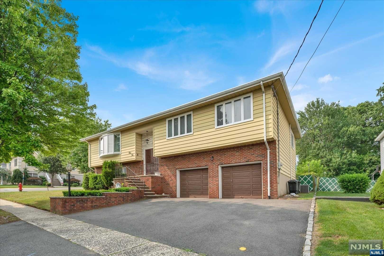 Welcome to this charming 4-bedroom bi-level in the heart of Lyndhurst.Proudly maintained by its original owners.Main level boasts gleaming hardwood floors, a bright airy living room and formal dining room perfect for family dinners and entertaining guests.The eat in kitchen offering a wonderful opportunity to customize and create your culinary haven.The ground level offers a generous family room with wood burning fireplace and a full kitchen adds extra convenience, perfect for those seeking multi-generational living or a separate living area with a private bedroom and full bath. Two walkouts provide easy access to the outdoors on a sprawling corner lot with ample space for outdoor activities.Easy access to NYC transportation.This home is truly a gem, offering pristine condition and a wonderful canvas for your personal updates and touches. For added convenience, you'll find that many places are within walking distance.Don't miss this rare opportunity to own a cherished property.