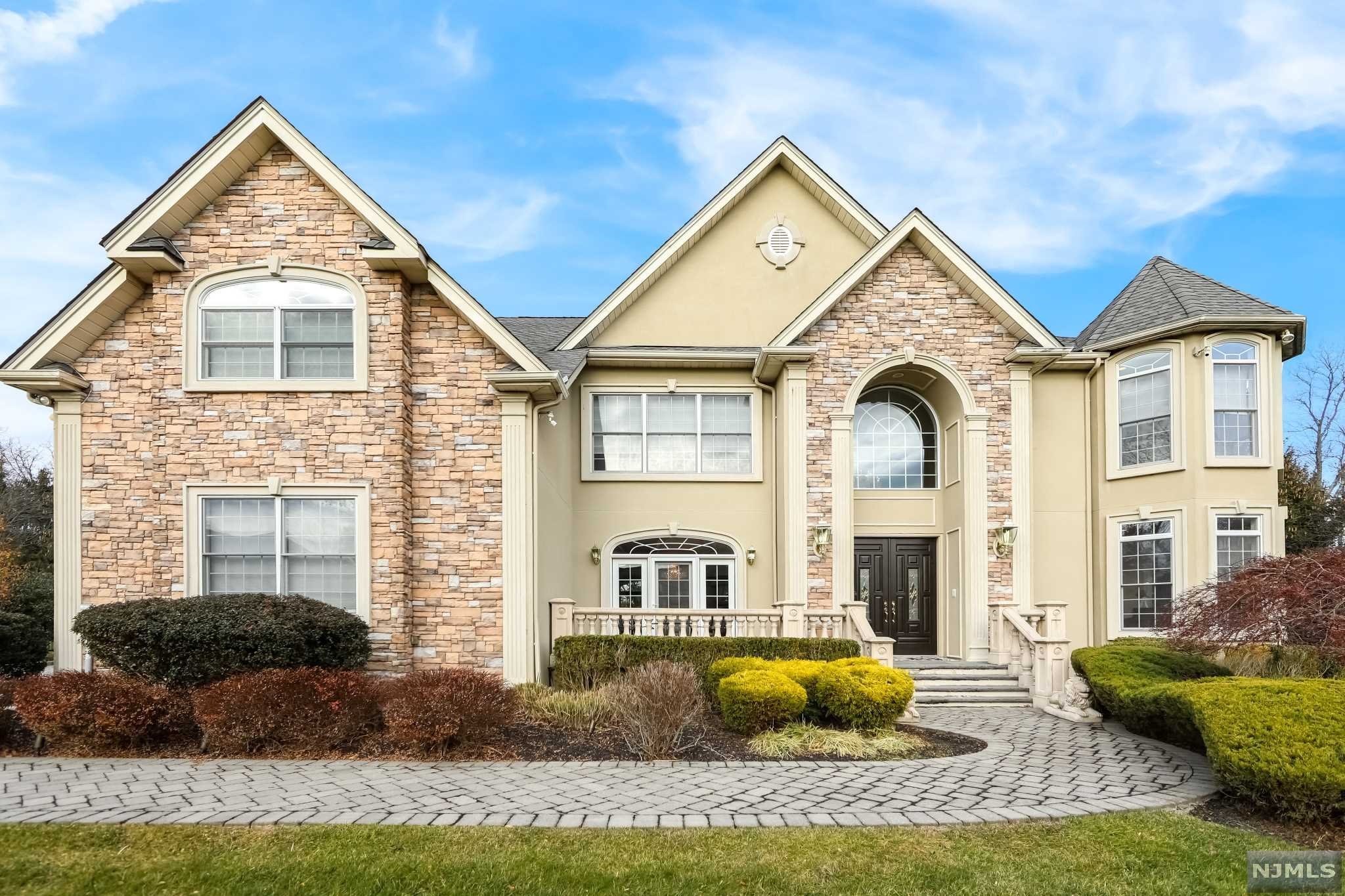 BEAUTIFUL HOME BUILT IN 2004 ON ONE OF THE MOST SOUGHT-AFTER STREETS IN ALL OF OLD TAPPAN, BERGEN COUNTY. MANY HIGH-END FEATURES INCLUDE: INTERCOM SYSTEM, OUTDOOR SPEAKERS, OUTDOOR LANDSCAPE LIGHTS, BACK UP GENERATOR, DOWNDRAFT VENT(KITCHEN), HEATED GARAGE, TILED GARAGE, LYNX BBQ, SURVEILLANCE SYSTEM AND FIRST FLOOR SURROUND SYSTEM. STUNNING OUTDOOR OASIS HAS A HEATED GUNITE POOL WITH WATERFALLS AND A CONNECTED HOT TUB. TWO STORY ENTRANCE FOYER WELCOMES YOU INTO THE HOME WITH AN OPEN FLOOR PLAN. FORMAL DINING AREA AND LARGE MODERN EAT-IN KITCHEN WITH TOP-OF-THE-LINE STAINLESS STEEL APPLIANCES, DOUBLE OVEN, AND WINE CHILLER. FAMILY ROOM HAS FLOOR TO CEILING WINDOWS WITH BRIGHT NATURAL LIGHTING. SECOND FLOOR IS COMPLETE WITH THREE BEDROOMS (GYM RM), AND THE MASTER SUITE. TWO WALK-IN CLOSETS & A SPA LIKE MASTER BATH. FULL UNFINISHED BASEMENT WITH GREAT POTENTIAL. NOT TO MENTION, BLUE RIBBON SCHOOLS AND CLOSE PROX. TO ALL NYC TRANSPORTATION AND SCHOOLS!