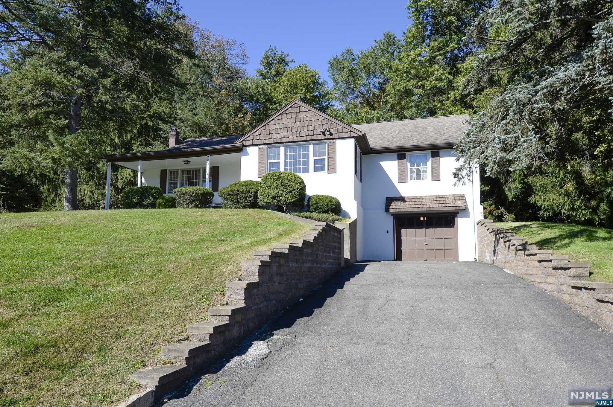 Charming and well maintained 3 bedroom, 2 full bath raised ranch nestled on a quiet street in a desirable part of Totowa! This home sits on a beautiful 130x200 sf property featuring a rare 2 driveways! Has an open lay out with 3 great sized bedrooms with hardwood floors throughout! Basement is clean and dry with a full bath and high ceilings and the potential to finish as desired. Low Totowa taxes! A must see home!