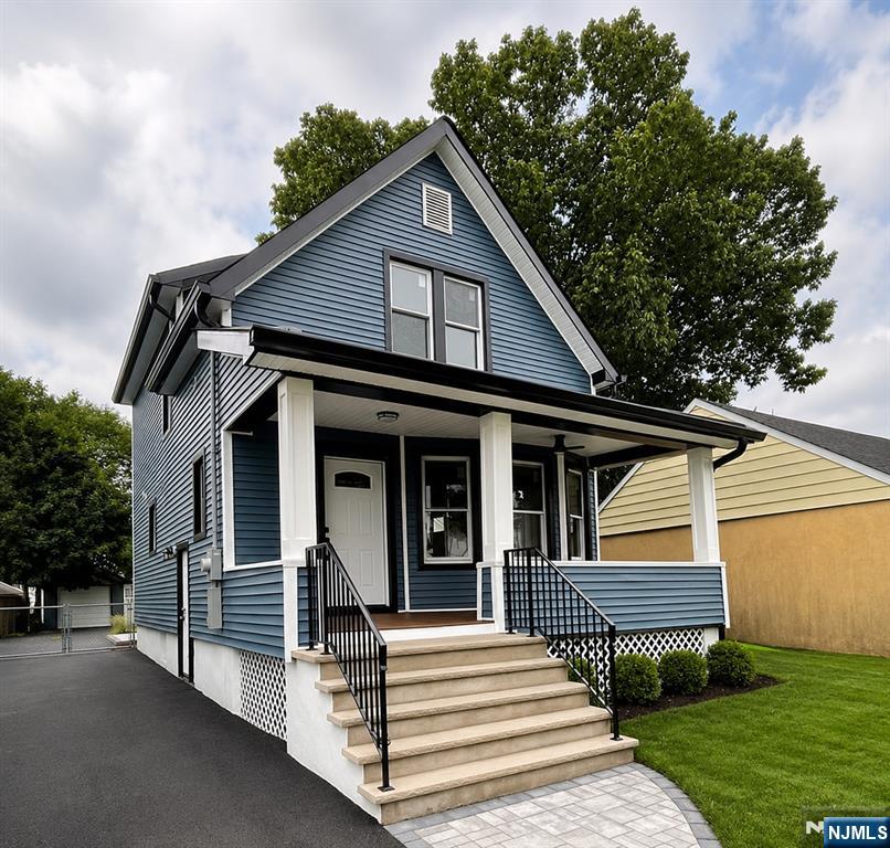 Completely renovated from top to bottom, this stunning 3-bedroom, 2.5-bath home offers the perfect blend of modern finishes and quality craftsmanship. Situated on an oversized 34 x 150 lot, every detail has been thoughtfully updated, including brand-new electrical, plumbing, roof, siding, kitchen, and bathrooms. Taken down to the studs and completely rebuilt, this home provides the quality and peace of mind of modern construction. Inside, you'll find beautiful hardwood flooring throughout, a bright open floor plan, and a beautifully designed kitchen with contemporary finishes. A convenient first-floor laundry room adds everyday functionality, while the spacious bedrooms and tastefully remodeled bathrooms complete the main living areas. The fully finished basement offers exceptional additional living space and features a full bathroom, making it ideal for a recreation room, home office, gym, or guest suite. Additional highlights include two-zone central air conditioning, two-zone forced hot air gas heat, a detached one-car garage, and a welcoming open front porch perfect for relaxing outdoors. Annual property taxes are $9,594. This truly move-in-ready home combines timeless charm with today's modern amenities and is conveniently located near shopping, dining, schools, parks, and transportation. Don't miss this exceptional opportunity!