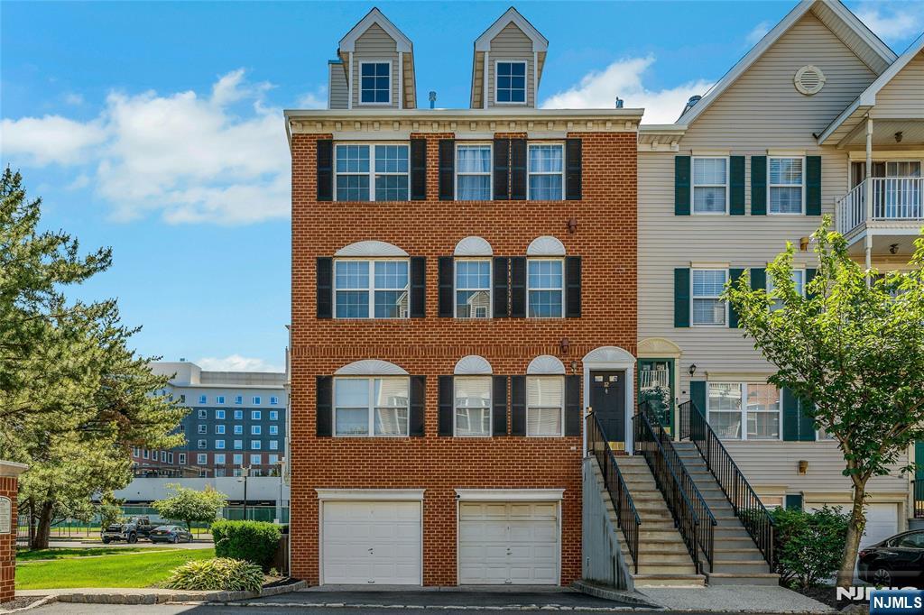 Location, location, location!-; Large 3 bed, 2.5 bath + garage corner end unit townhome in Newark's most sought after condominium, Society Hill at University Heights.-; A home that provides the best of both worlds, with a tree lined suburban feel yet minutes from all the city has to offer-; This is an upper level corner unit (with no one above you) that's bathed in natural sunlight.-; The 1st floor features a large living room (with wood burning fireplace), dining room, kitchen & half bath.-; The 2nd floor has 3 generously sized bedrooms with the primary having a private ensuite bath.-; Simply pack your bags and move right in.-; Community amenities include private security patrol, swimming pool, tennis courts, tot lot & club house; The home is located in Phase III of the community (the closest section to Rutgers University medical & undergraduate schools and NJIT)-; Easy transportation access (via light rail station that's only 2 blocks away and 4 bus lines) providing a less than 10 minute ride to downtown, home to Newark Penn Station, Whole Foods, NJPAC & Prudential Center.-; Quick & easy access to NY Penn Station, the World Trade Center & Newark Airport (via NJ Transit, PATH or express bus)-; Fun Fact - Newark provides faster access to midtown Manhattan than most outer borough locations of NYC.