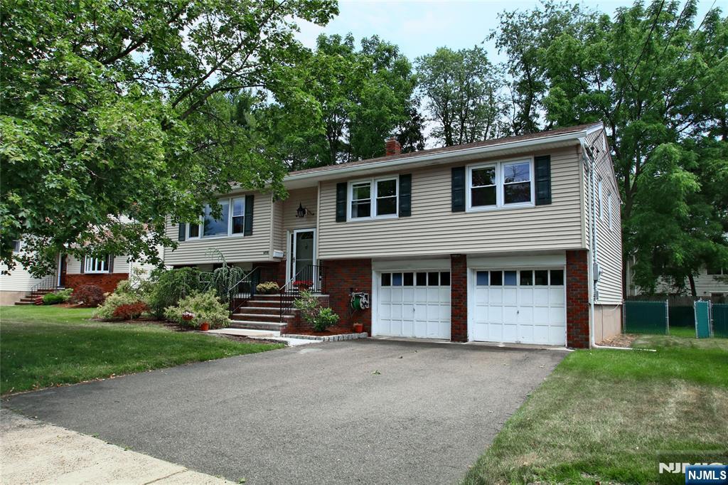 Beautifully located in the Radburn school area on a quiet, tree-lined street, this home offers over 2,000 sq ft of open living space. The updated eat-in kitchen features stainless steel appliances, ceramic tile flooring, granite countertops, a large picture window, and a French door leading to a deck overlooking the fenced-in private backyard with a shed. The first floor includes a spacious living room, formal dining room, primary bedroom with full bath, two generous bedrooms, and an updated hall bathâ€”all with newly refinished hardwood floors. The lower level adds a fourth bedroom, a family room with sliding doors to the patio and yard, a guest bath, and abundant storage. Minutes to houses of worship, express NYC transportation, shopping, and beautiful parks. A must-see opportunity.