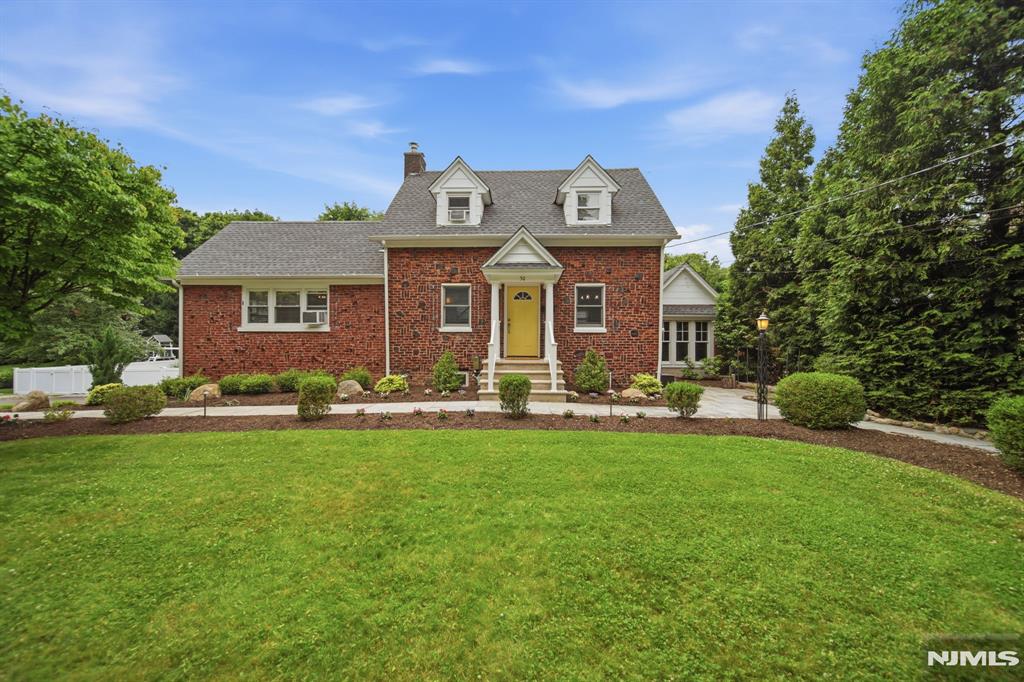 Location, location, location! This beautiful all-brick home sits on a picturesque half-acre lot in one of Bergen Countyâ€™s most desirable communities, and blends classic charm with modern updates. The main level features a welcoming living room anchored by a wood-burning fireplace, a renovated kitchen with white cabinetry, granite countertops, stainless steel appliances, and access to a screened porch overlooking the expansive yard, plus a spacious, sun-filled primary bedroom. Upstairs youâ€™ll find two generously sized bedrooms with ample closet space and a full bath. The walk-out lower level includes a recreation room, full bath, laundry area, and storage. Professionally landscaped grounds showcase new walkways, a paver patio, fully fenced yard, a new shed and a screened porch, while a separate outbuilding with vaulted ceilings is ideal for a studio, workshop, gym, or storage. Just minutes from downtown Park Ridge, including parks, dining, shopping, excellent schools and convenient NYC access via train and bus. Hurry!