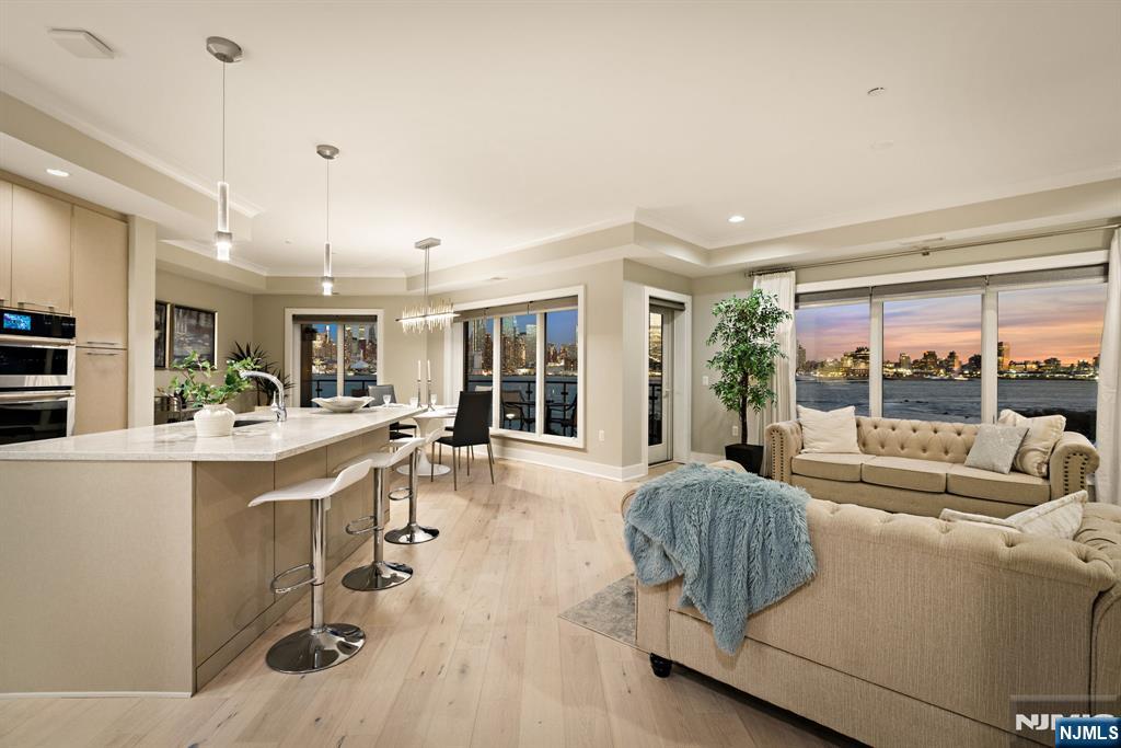 This residence boasts an unparalleled view of the New York City skyline, with every window framing the iconic Manhattan landscape in stunning clarity. The panorama stretches across the Hudson River, offering a dynamic vista from sunrise to the cityâ€™s glittering nighttime glow. From your private balcony, the view captivates at every hour, showcasing the best of New York with an elegance that transforms daily life into a luxurious experience. Whether day or night, this is a view that commands attention and epitomizes sophisticated waterfront living. Luxurious 6-inch European white oak floors, add a sleek, modern aesthetic that complements the residenceâ€™s sophisticated ambiance. Unit 206 is a proud member of Henley On Hudson, a well-manicured community of luxury homes whose amenities include a concierge, swimming pool, three fitness centers, children's playroom and cinema. Residents relish direct access to the New York Waterway and unparalleled views of The Greatest City in the World.