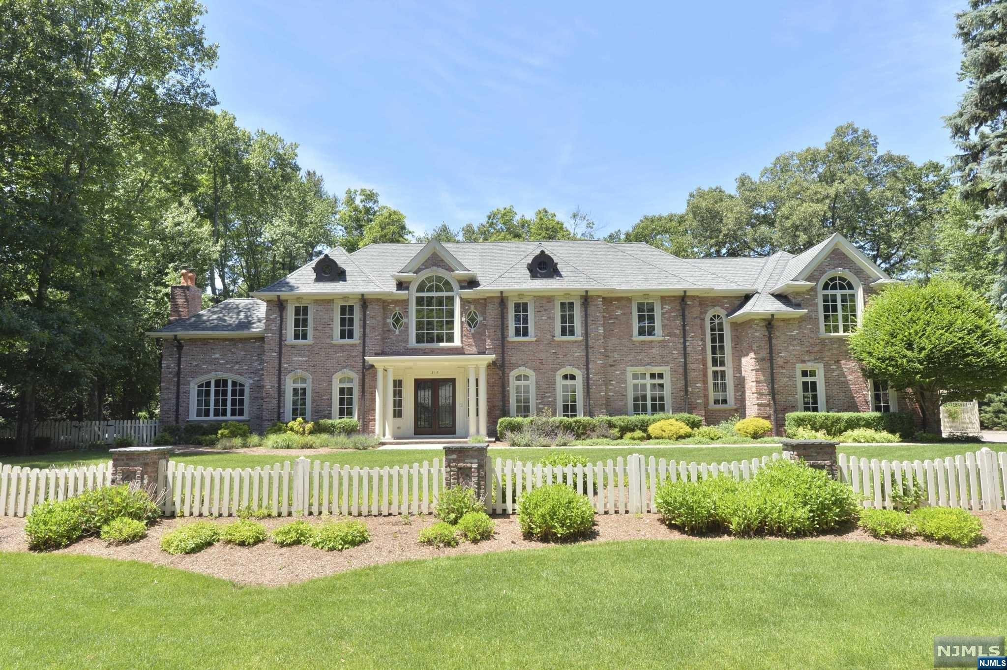 2005 all brick manor by L & L builders is ready to move in. No expense spared on a premier lot backed by preserved land on multi-million $ sought after street. State of the art finishings including reclaimed French limestone foyer entry, circular stairs, cherry floors, coffered ceilings, and fabulous upgrades including kitchen, baths, master bedroom closets, and amenities too numerous to list. The exterior grounds are beautifully landscaped, and offer a koi pond, potting shed, inground heated pool, cabana and pergola. 4 car garage. Pool is separately fenced and surrounded by brick stanchions. Great floorplan for working remotely and entertaining.