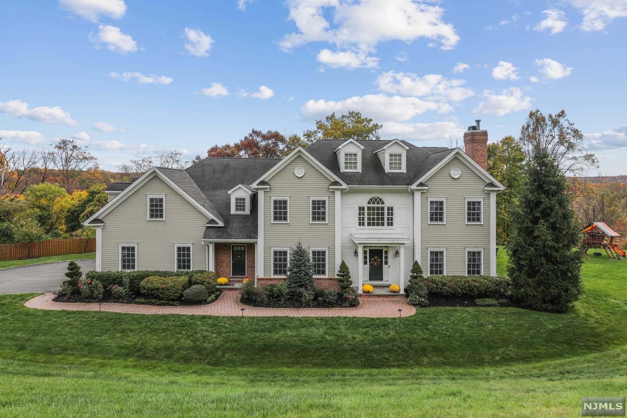 Stunning 2005 Center Hall Colonial, dual staircases, Beautifully finished 4 levels, large formal living room and dining room, spacious bedrooms, exceptional leisure space, Interior features include Hard Wood floors with in-lay, built-ins, crown moldings, recessed lights, window seats. Dream Chef's kitchen with door to patio, open to Two Story Great Room, covered porch, 1st floor Bedroom and full bath. 2nd level: 4 BRs most walk-in Calif Closets; Master BR Suite, En-Suite Bedroom, Jack & Jill Bedroom, office, large laundry room. 3rd level: large office. Lower Level includes a Media Room with equipment, Games Room, Yoga/Home Gym/Dance Room, Private Office, full Bath & Flex rooms. Perfect Stay-Cation Home! Beautifully landscaped, cul-de-sac, 3-car garage, security system, sprinkler system, see Amenities List