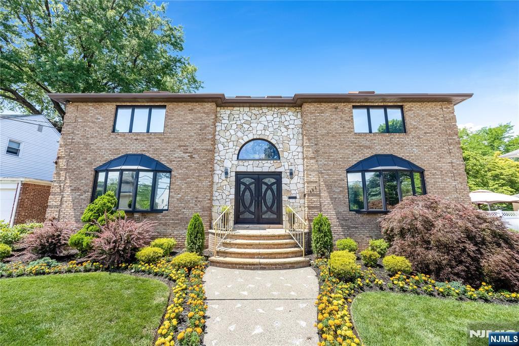 Magnificent custom home featuring 6 spacious bedrooms and 5 bathrooms (3 full, 2 half). A grand foyer welcomes you into an elegant center hall leading to a formal dining room, sitting room, and private office. The impressive great room showcases soaring ceilings, a gas fireplace, a striking rock accent wall, and a beautiful spiral staircase. The gourmet eat-in kitchen features a center island, perfect for everyday living and entertaining. Convenient first-floor powder room and laundry room with washer and dryer. The fully finished basement provides exceptional additional living and entertainment space. Step outside to a spacious deck, perfect for outdoor dining, entertaining, or relaxing. A dettached garage offers added convenience for parking and storage. A truly exceptional property that combines luxury, comfort, and functionality throughout.