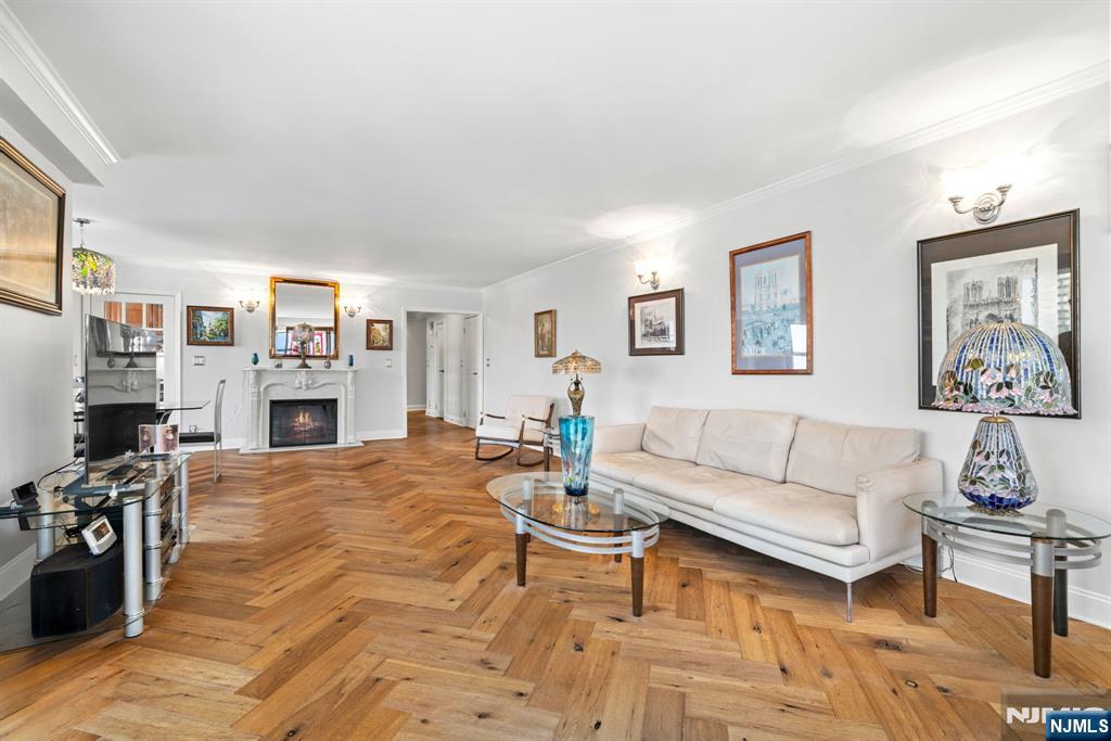 Experience the prestigious Parker Imperial in this impeccably renovated 2-bedroom, 2-bath residence offering approximately 1,705 square feet of refined luxury. Perfectly positioned along sought-after Boulevard East, Unit 6A showcases views of the Manhattan skyline, Hudson River and James J. Braddock park, from a private covered balcony. Designed with sophistication and comfort in mind, the home features imported white oak herringbone flooring, a custom chefâ€™s kitchen with premium appliances, spacious sun-filled living areas, and a stunning primary suite with spa-inspired bath and California walk-in closet. Residents enjoy full-service luxury amenities including a 24-hour doorman, fitness center, outdoor heated pool, tennis/pickleball access nearby, garage parking, on-site management, and easy transportation to Manhattan. Exciting capital improvements are currently underway, with beautifully redesigned lobby and pool areas nearing completion, enhancing both the lifestyle experience and long-term value of the building. Best of all, there is NO assessment balance to be assumed by the new owner.