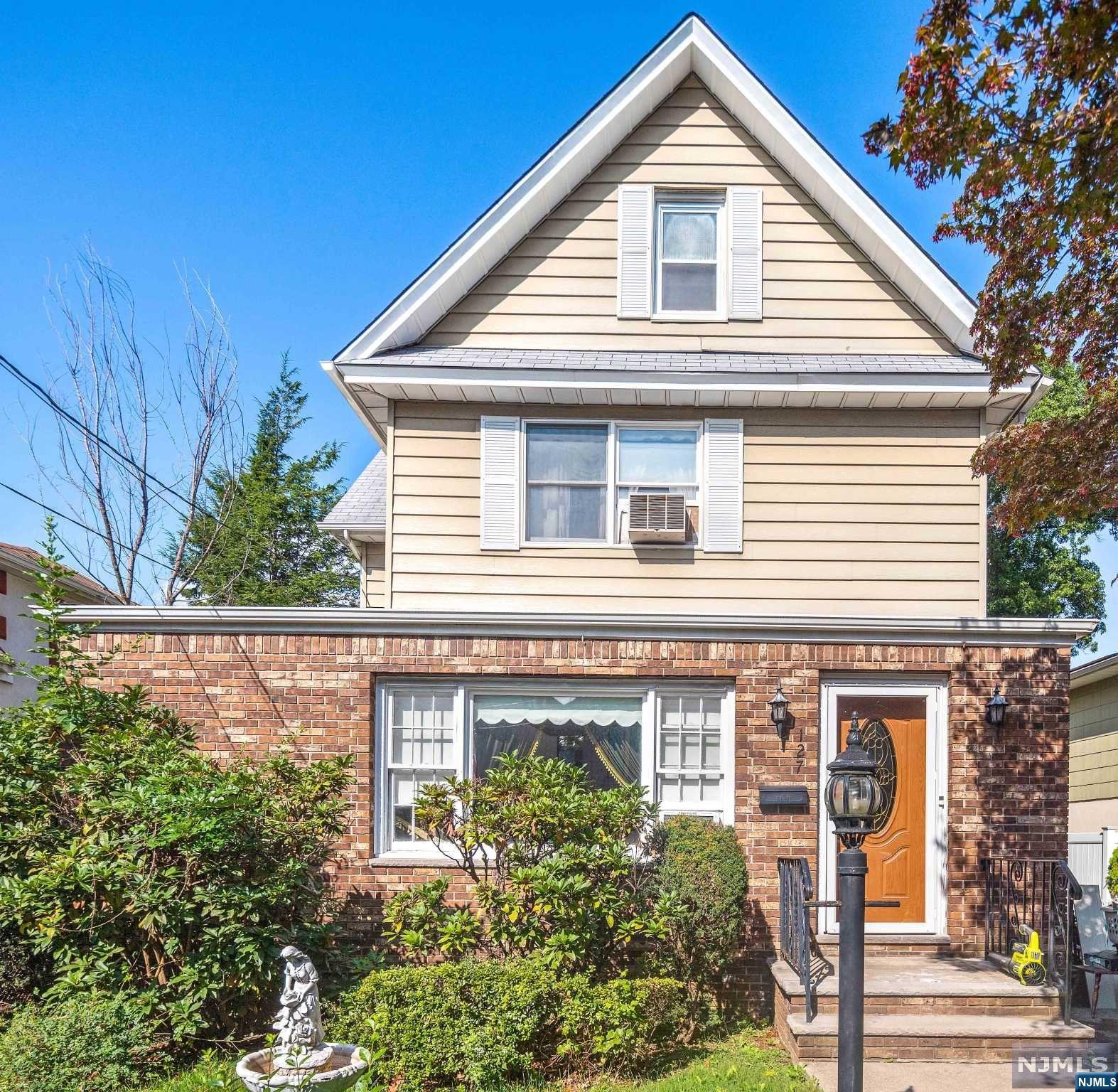 Charming Side Hall Colonial in desirable neighborhood. Bring your bright ideas and create your dream home. First floor features entry foyer, large living room, formal dining room, den and kitchen with access to yard. Second floor features 3 bedrooms and full bath. Ground floor is finished with a rec room, summer kitchen, half bath and back door leading to backyard. Nice yard and detached garage. Walking distance to Main Street in Fort Lee and public transportation. Here's your chance to live in Leonia at an affordable price with a great community and school system.