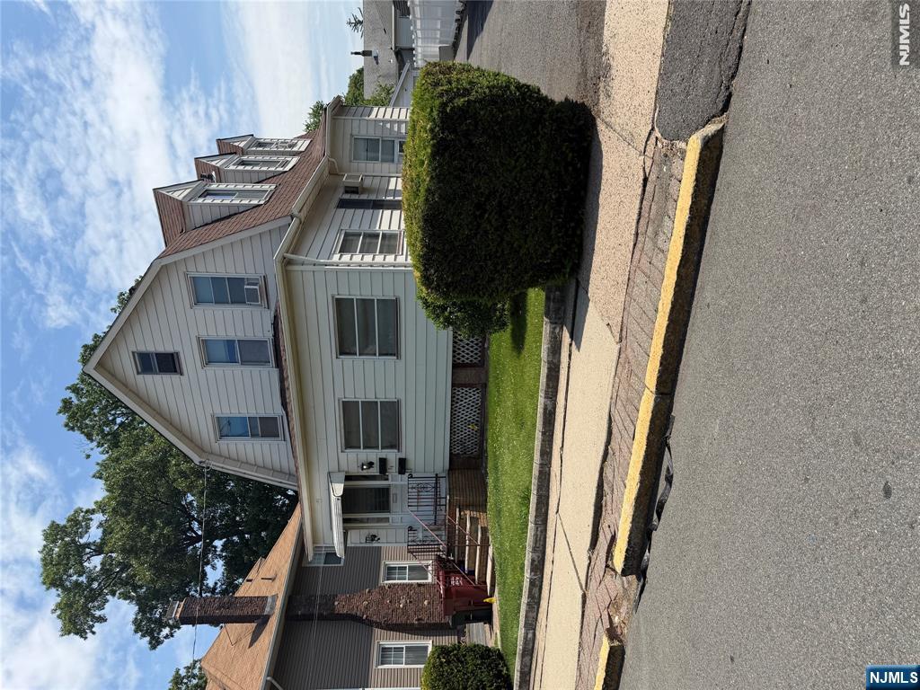 Ideal investment opportunity. First floor features a living room, kitchen, full bath and bedroom, with access to a full basement with two finished, separate rooms and laundry. There is also access out to the rear yard from the kitchen. Second floor features a kitchen, living room, 2 bedrooms, full bath with attic access. Separate gas and electric meters. Large enclosed front porch shared by both units. Deep lot with 2 car detached garage being sold as-is. Driveway parking for 6 cars. Located within seconds of bus transportation, and located just short distances to schools, shopping and parks.