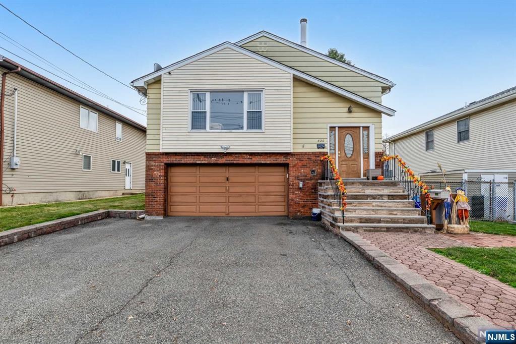 Welcome to 520 Outwater Ln in Garfield NJ. This beautiful bi-level home offers a open modern floor plan of 2,456 sqft of living space, with newly refinished hardwood floors and freshly refinished kitchen cabinets with granite countertops. This house offers 4 bedrooms and 2 full bathrooms, with a ground floor walkout mother-daughter set up great for extended family. The house also offer a level lot, 2 car garage and a spacious driveway for additional parking. This Home is located close to all major highways and public transportation, with plauderville train station being a 5 minute walk from the house.