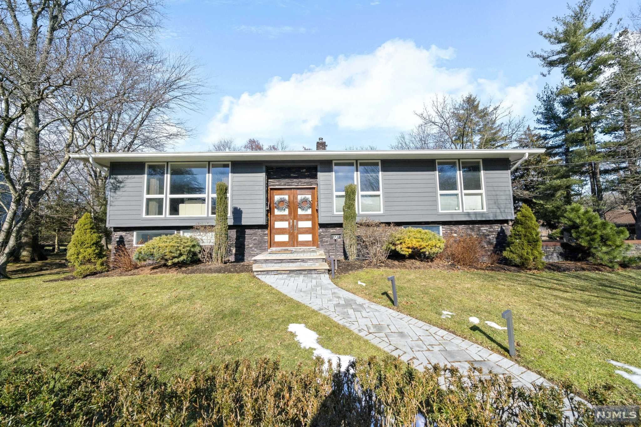 Welcome home! Minutes away from GBW is this ultra modern bi-level property. The first floor boasts a beautiful open concept kitchen with vaulted ceilings and high-end stainless steel appliances. The dinning room and living room spaces are bright with custom oversized windows and beautiful hardwood floors, 3 bedrooms are conveniently located on this level along with the main bathroom and the gorgeous and spacious master bath. The ground level is where you will find your 4th bedroom and the family room or game room, spacious, bright with sliding doors that welcome you to a gorgeous, and very private back yard featuring your very own heated in-ground pool and a raised modern deck that over looks your own private oasis. Central heating and cooling , and 2 car garage accessible from the ground floor. Close to shops, restaurants and houses of worship, contact us today for a private showing.