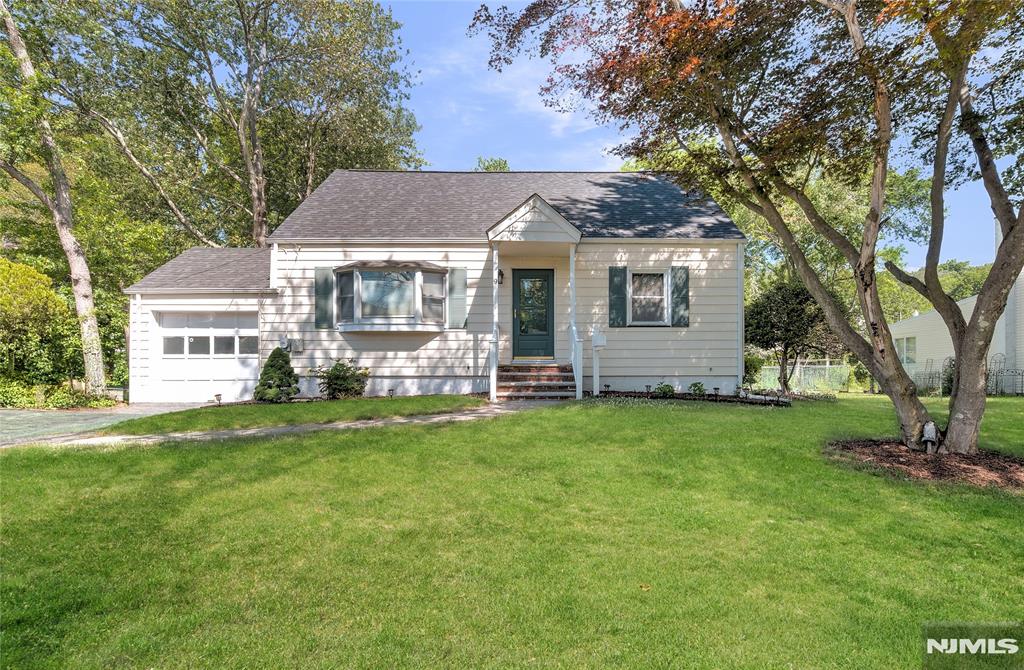 Well maintained 4 bedroom, 2 full bath Cape Cod set on a desirable large, level 75x149 lot in the heart of town. Featuring neutral decor and paint throughout, this meticulously maintained home offers 2 bedrooms and 1 full bath on each level, creating flexibility for guests, home office space or a variety of lifestyle needs. Large welcoming living room with recessed lighting. Updated kitchen with granite counters, center island with decorative pendant lighting, recessed lighting and stainless steel appliances. Updated baths. Enjoy morning coffee or unwind in the enclosed 3 season sunroom overlooking soft natural views and the expansive level rear yard, ideal for entertaining, play or gardening. Major updates since 2023 include new 2nd floor windows, new interior doors and frames, refinished hardwood floors on main level, new wood flooring on second level, new heat and central air, new hot water heater, new washer, new dishwasher, refrigerator and exterior vented exhaust hood, new chimney liner, electric car charger and water softener. Additional improvements include brand new roof, front steps and railings in 2021. Convenient to schools, town pool, parks, playgrounds, library, shopping and NYC transportation. Just moments from scenic Littellâ€™s Pond and recently renovated Littell Peopleâ€™s Park featuring walking trails, fishing opportunities, benches and playground areas.