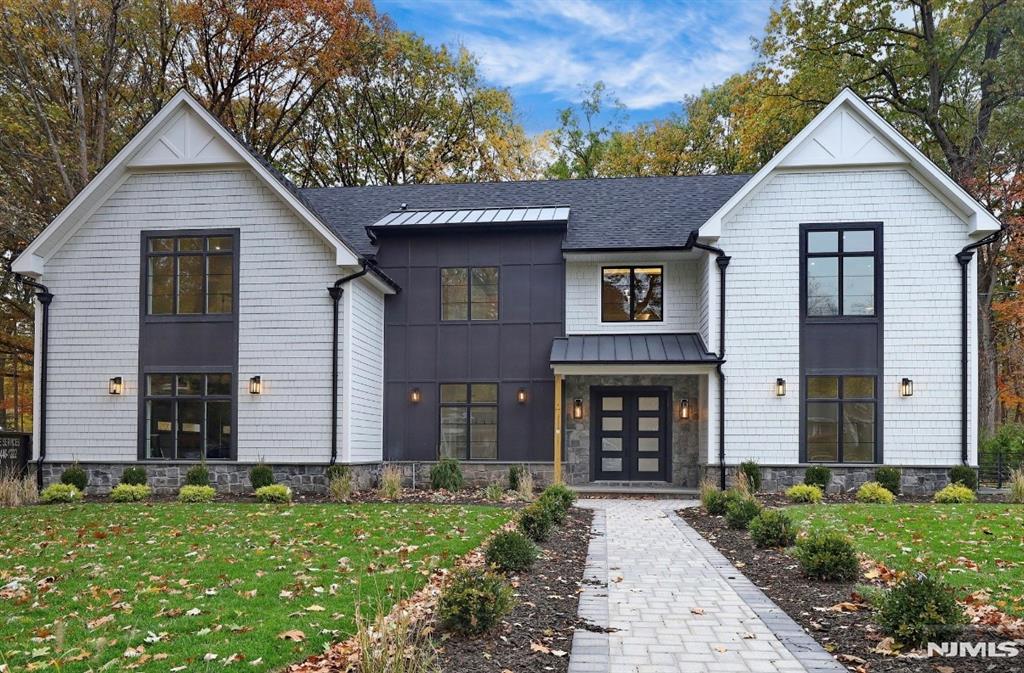 Discover luxury at its finest in prestigious Haworth with this exceptional 6 BR, 6.5-bath, 7,500+ sf new-construction masterpiece. Crafted with uncompromising detail, this home showcases exquisite design and superior craftsmanship. Set on a magnificent @16,000 sf lot, itâ€™s a nature-loverâ€™s paradise overlooking lush town woodlands. Main level features a grand open layout where the gourmet kit, dining room, and dramatic family room w/fireplace flow seamlessly. A covered patio w/its own fireplace offers a year-round retreat. This floor also includes an office, BR #5 w/full bath, powder room, and mudroom. 10 ft ceilings elevate the space, while the family room boasts soaring 20-ft ceilings and expansive windows. The Primary Suite is a true sanctuary w/fireplace, private balcony, spa-like bath, and 2 walk-in closets. 3 addit'l ensuite bedrooms, a loft, and laundry complete the 2nd fl. Radiant heat enhances the primary bath and 2 add'l baths. The light-filled lower level includes a large recreation room w/ wet bar, BR #6, full bath, media room, and playroom. A spacious 3-car garage and large backyard w/room for a pool complete the home. All baths feature Porcelanosa tile and high-end kitchen includes Dekton countertops, Wolf range and Sub-Zero refrigerator. Haworth is ranked #1 suburb in NJ and #5 in USA, with its Kâ€“8 school ranked #6 in NJ. Enjoy a short walk to parks, NYC bus, and downtown, Haworth is home to 2 country clubs and a short drive to world-class dining and shopp