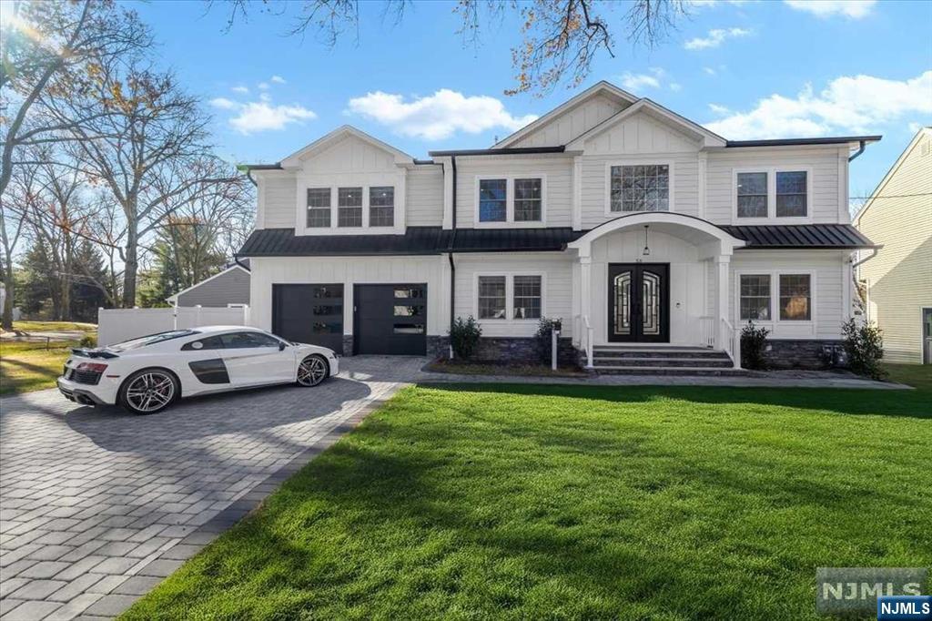 Live in luxury in this stunning one year young 6 bedroom 6 bath colonial. Desirable private neighborhood with the convenience of being in close proximity to all that Paramus has to offer. Whether you enter in thru the 2 story foyer or in thru the 2 car garage to mudroom, you are greeted with natural sunlight all around. This level offers everything from the first floor ensuite, gourmet kitchen, family room with cozy gas fireplace, formal living room, butler's pantry leading to the dining room, and powder room. Up the stairs to the left leads into the primary suite, complete w/ gas fireplace, 2 walk-in closets and spa-like bath w/ soaking tub. 4 additional bedrooms and 2 full baths complete the second floor. Additional finished space in the full basement, exercise room, wired media room and half bath. Large fenced in corner lot with patio gives ample space for outdoor entertainment. Perfect for those looking for space, style, and convenience in a private, accessible, location.